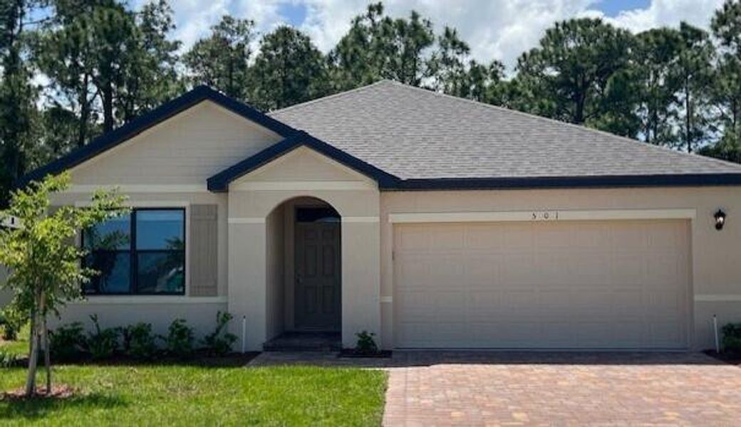 Front exterior of a new home in Morningside, Fort Pierce, FL, highlighting curb appeal (Image 1). Front exterior of a new home in Morningside, Fort Pierce, FL, highlighting curb appeal (Image 1).