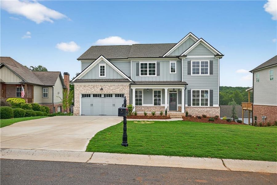 Front exterior of a new home in , Jefferson, GA, highlighting curb appeal (Image 1).