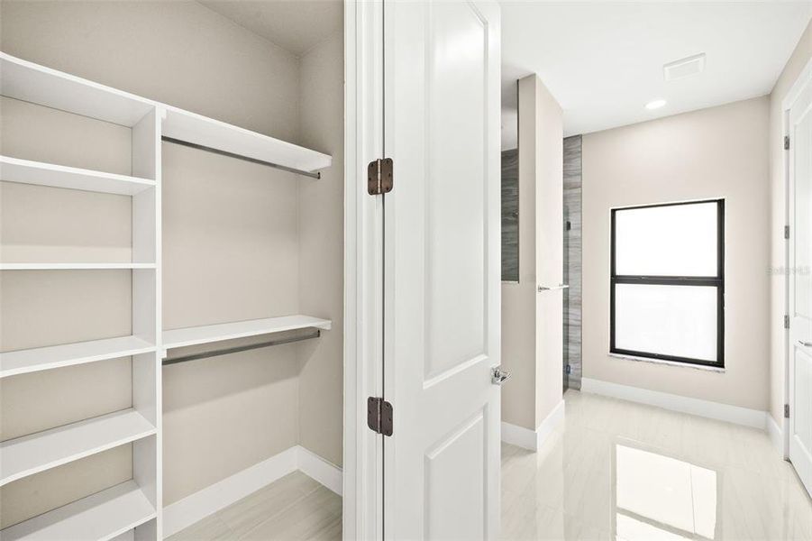 Second Primary Walk-In Closet with Built-In Shelving Second Primary Walk-In Closet with Built-In Shelving
