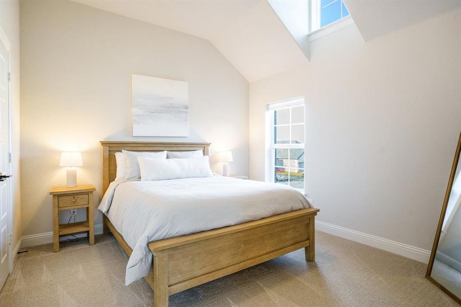 Elevated and Airy - This upstairs bedroom feels anything but secondary thanks to vaulted ceilings, dual window exposures, and crisp, clean finishes. Elevated and Airy - This upstairs bedroom feels anything but secondary thanks to vaulted ceilings, dual window exposures, and crisp, clean finishes.