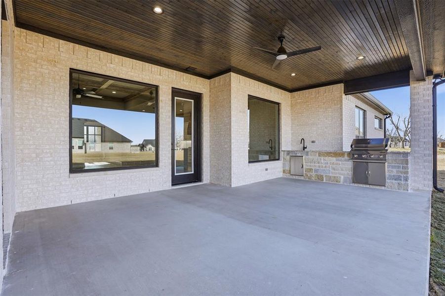 Built in outdoor kitchen with grill, sink and prep area Built in outdoor kitchen with grill, sink and prep area