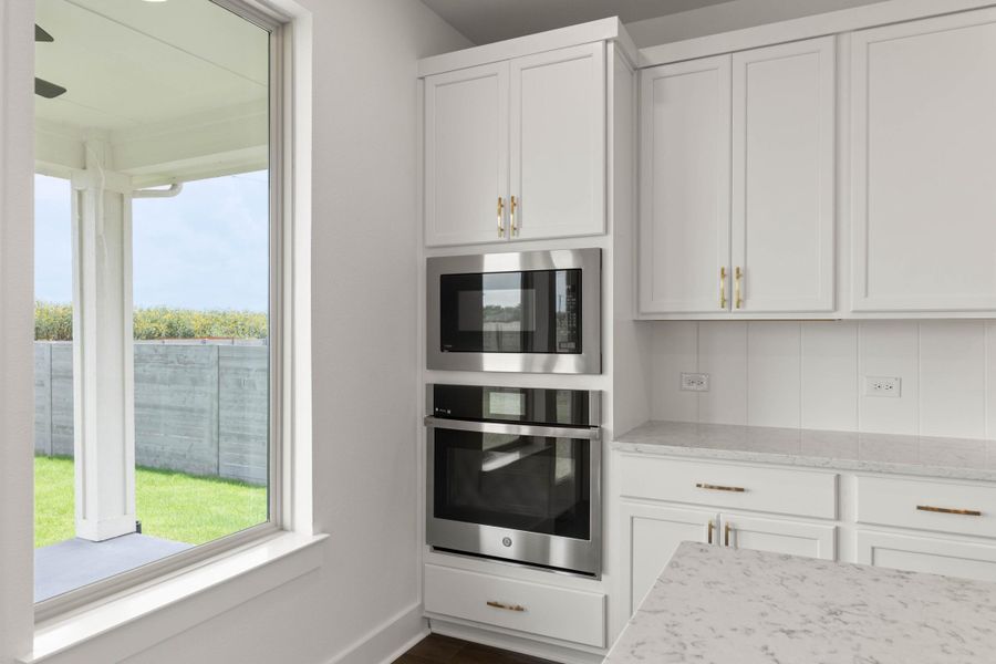 Furnished interior view inside a new home in Cottage Collection at Harvest, Argyle (Image 8).