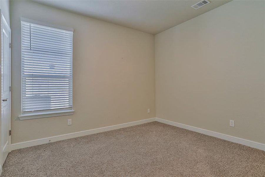 Empty room featuring carpet floors and baseboards Empty room featuring carpet floors and baseboards