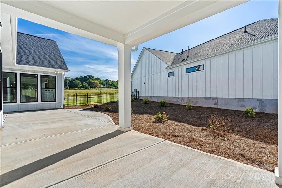Exterior details and patio area of a home in The Courtyards at Lake Davidson, Mooresville (Image 4).
