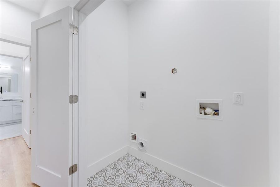 Double door, decorated tile utility room upstairs.