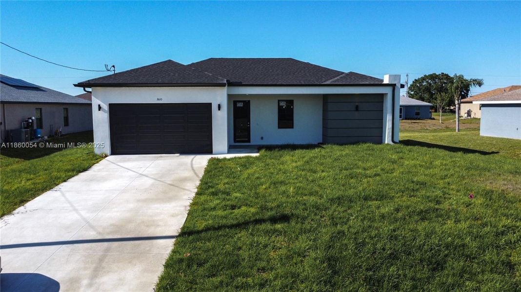 Front exterior of a new home in , Lehigh Acres, FL, highlighting curb appeal (Image 26).
