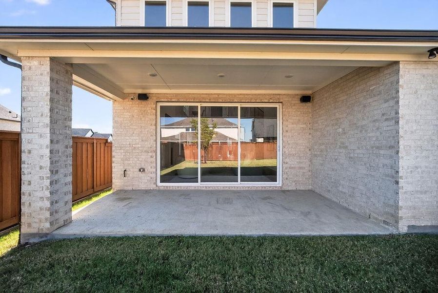 Doorway to property with a patio area and brick siding Doorway to property with a patio area and brick siding