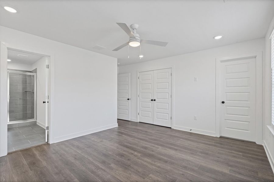 Wood-finish flooring, recessed lighting, and a ceiling fan