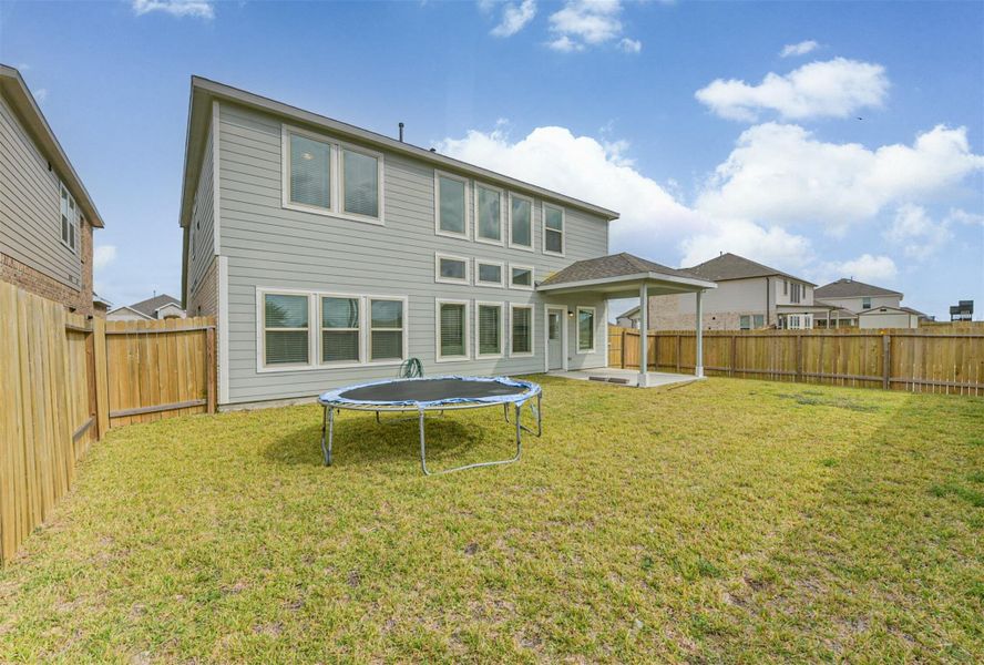 Exterior details and patio area of a home in Kendall Lakes, Alvin (Image 4). Exterior details and patio area of a home in Kendall Lakes, Alvin (Image 4).