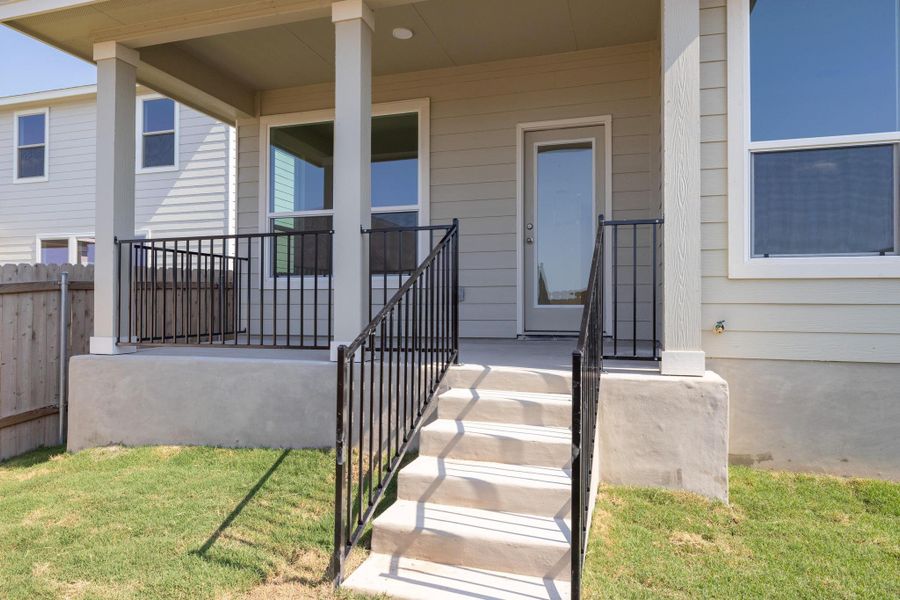 Front exterior of a new home in Sonterra - Cool Water, Jarrell, TX, highlighting curb appeal (Image 13).