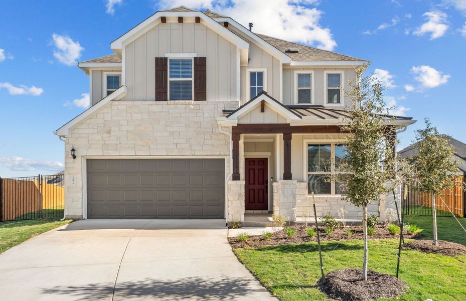 Front exterior of a new home in Santa Rita Ranch, Liberty Hill, TX, highlighting curb appeal (Image 23).