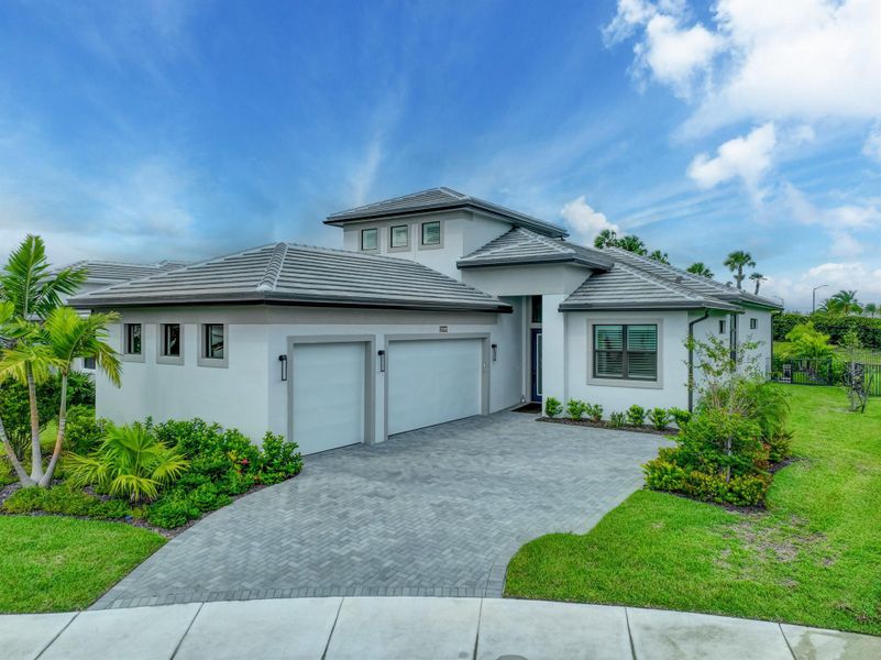 Front exterior of a new home in , Westlake, FL, highlighting curb appeal (Image 1).