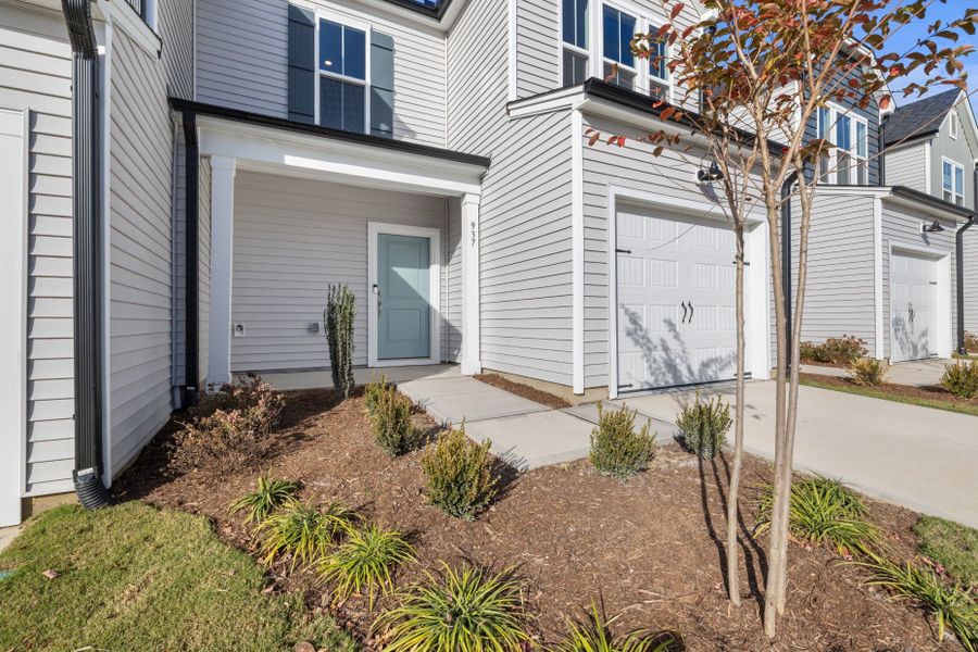 Exterior details and patio area of a home in Poets Walk, Whitsett (Image 4).