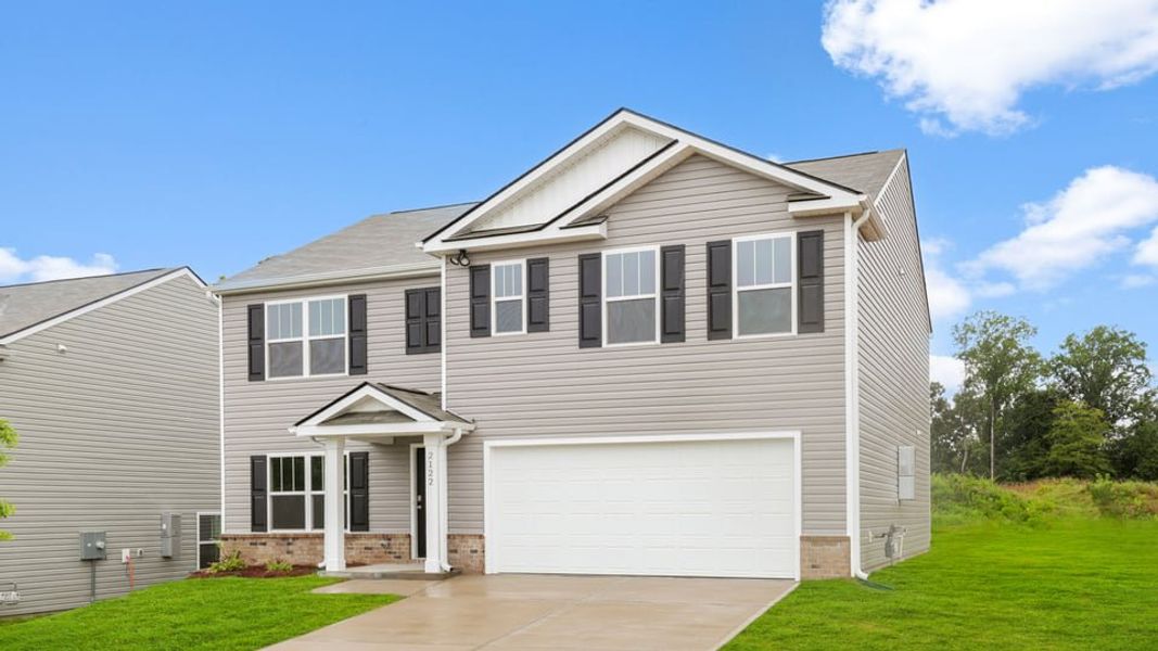 Front exterior of a new home in Treemont Commons, Wellford, SC, highlighting curb appeal (Image 2). Front exterior of a new home in Treemont Commons, Wellford, SC, highlighting curb appeal (Image 2).