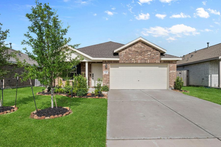 Front exterior of a new home in Sterling Point at Baytown Crossings: Watermill Collection, Baytown, TX, highlighting curb appeal (Image 1). Front exterior of a new home in Sterling Point at Baytown Crossings: Watermill Collection, Baytown, TX, highlighting curb appeal (Image 1).
