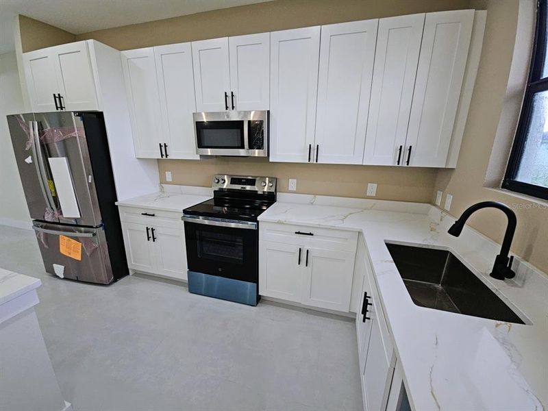 Furnished interior view inside a new home in , Port Charlotte (Image 15).