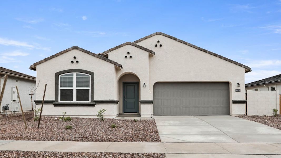 Representative exterior photo of a completed home built from the McCormick by D.R. Horton in Rio Rancho Estates, Surprise, AZ (Image 16).