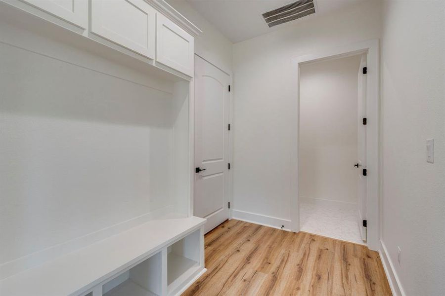 Mudroom featuring light wood-type flooring