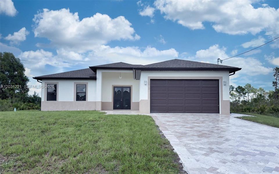 Front exterior of a new home in , Lehigh Acres, FL, highlighting curb appeal (Image 18).