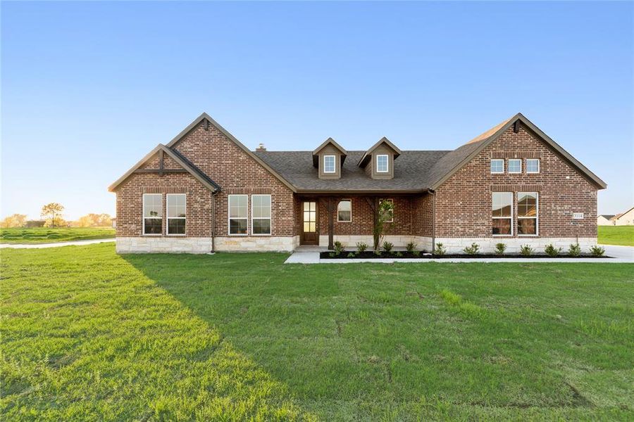 Front exterior of a new home in Oak Valley, Oak Ridge, TX, highlighting curb appeal (Image 23).