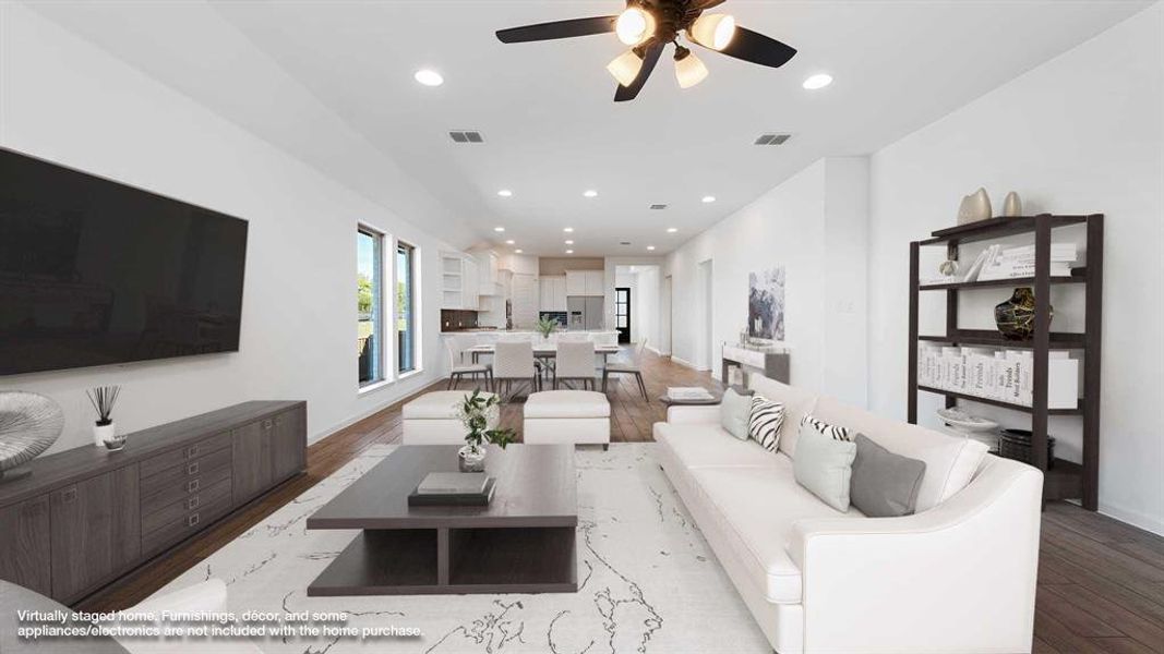 Living room with ceiling fan and light hardwood / wood-style floors