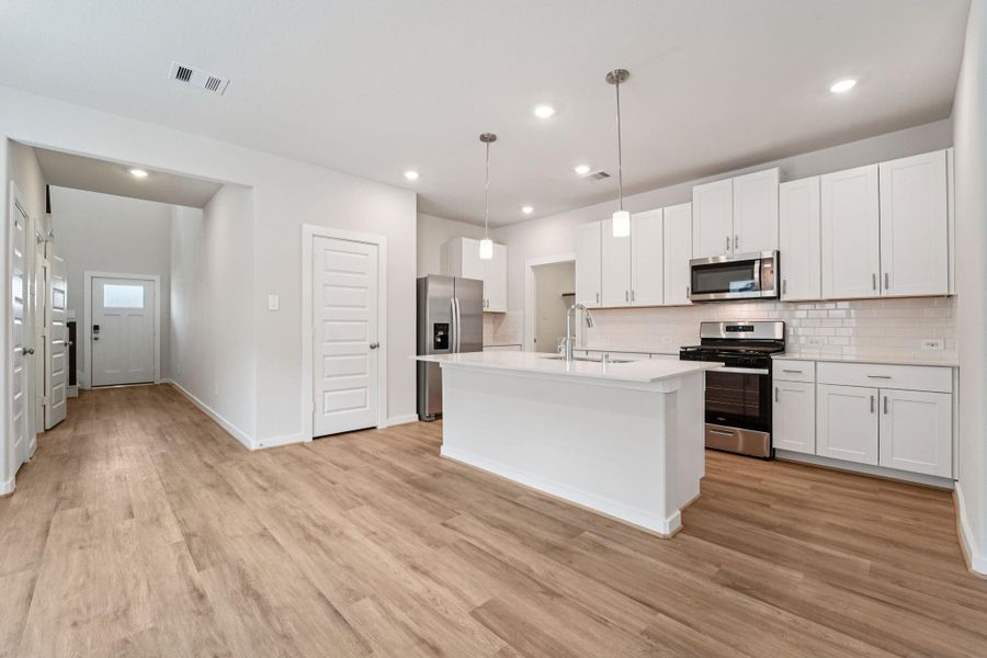 Furnished interior view inside a new home in Landing Meadows - Traditional Series, New Caney (Image 7). Furnished interior view inside a new home in Landing Meadows - Traditional Series, New Caney (Image 7).