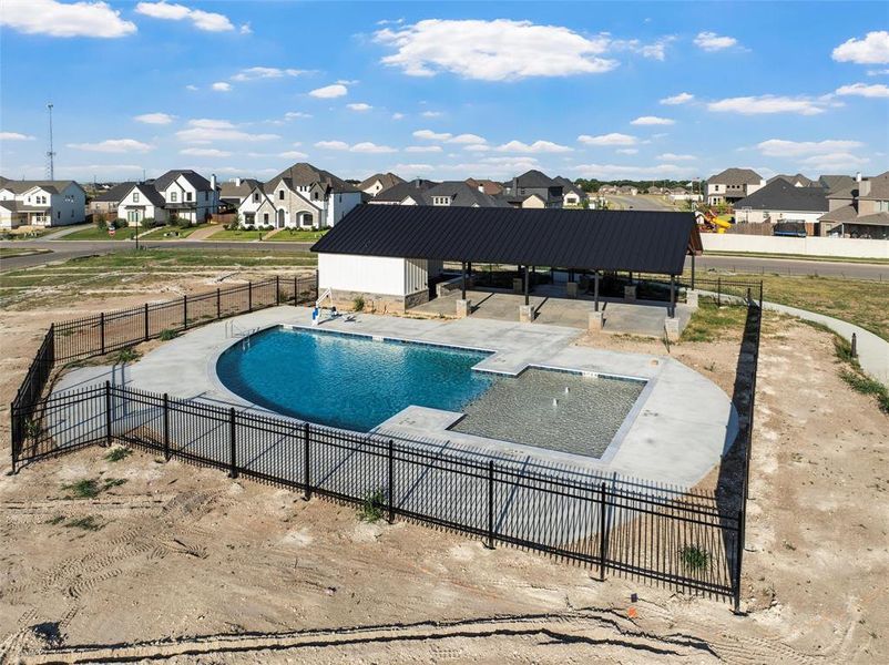 Community pool featuring a patio area and a residential view Community pool featuring a patio area and a residential view