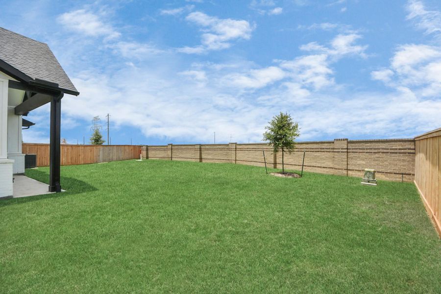 Front exterior of a new home in Bridgeland: Signature Collection, Cypress, TX, highlighting curb appeal (Image 2). Front exterior of a new home in Bridgeland: Signature Collection, Cypress, TX, highlighting curb appeal (Image 2).