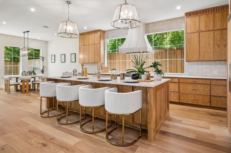 Kitchen island seating, custom hood, Mizu Silver tile backsplash, open to breakfast area Kitchen island seating, custom hood, Mizu Silver tile backsplash, open to breakfast area