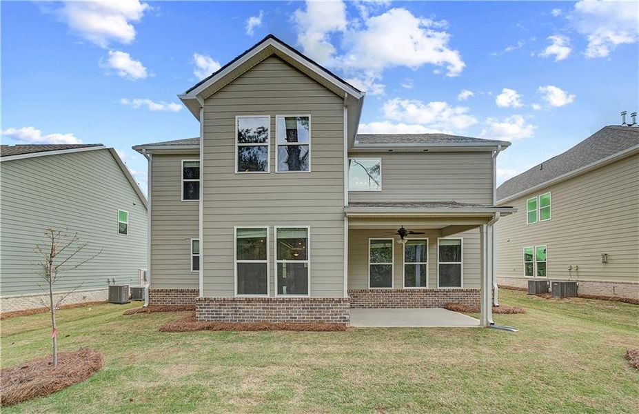 Front exterior of a new home in Cooper Park, McDonough, GA, highlighting curb appeal (Image 1).