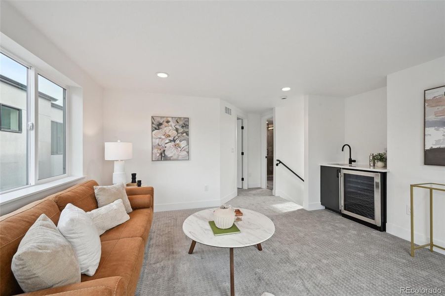 Third floor bonus room, walk out roof deck, wet bar and views!