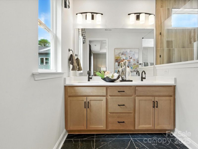 Dual Vanity at Primary Suite with Convenient Storage. *Model Photos | Actual Finishes, Structural Selection, and Orientation May Vary.