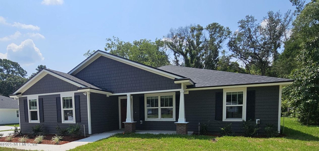 Front exterior of a new home in , Jacksonville, FL, highlighting curb appeal (Image 25).