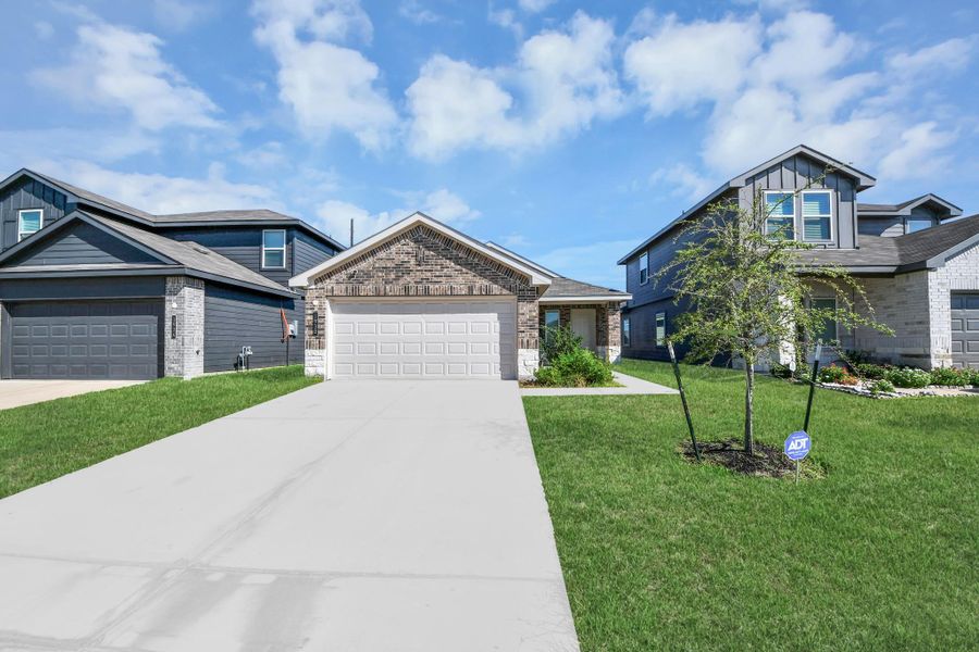 Front exterior of a new home in Legacy Park, Houston, TX, highlighting curb appeal (Image 23).