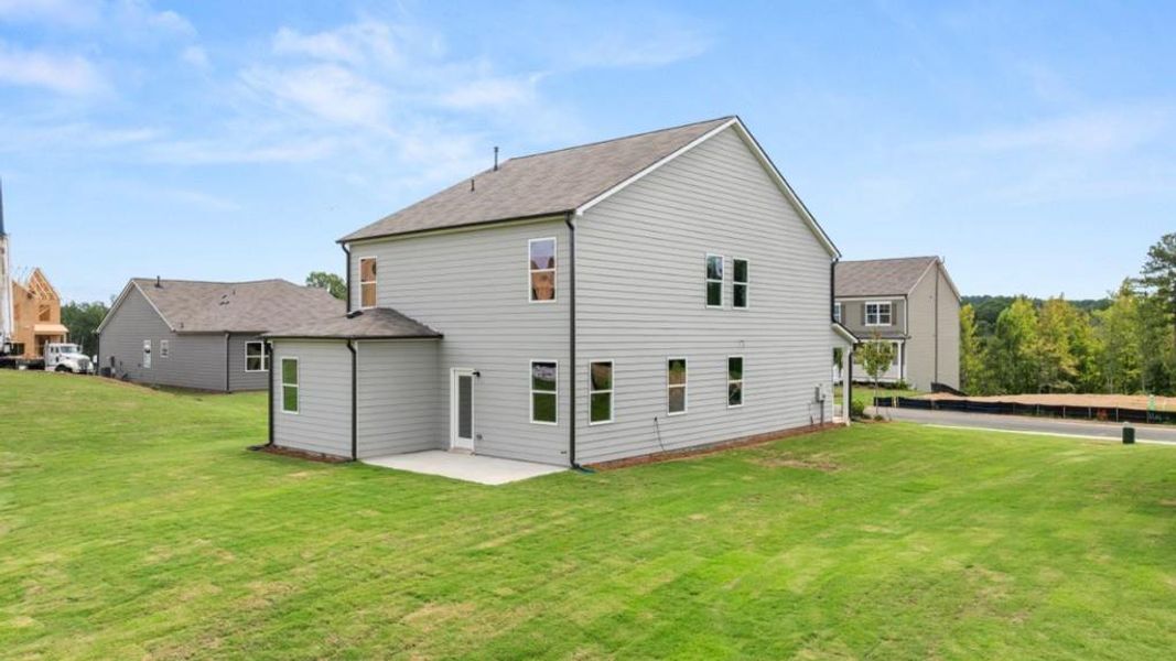 Front exterior of a new home in Sheffield Highlands, Dallas, GA, highlighting curb appeal (Image 22).