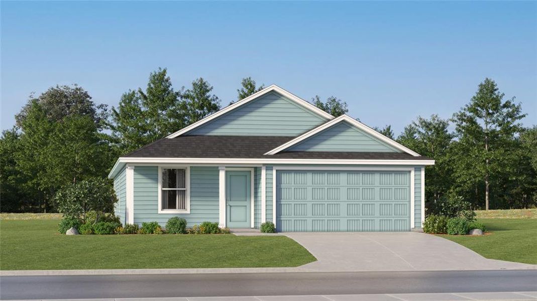 View of front facade featuring a garage and a front lawn