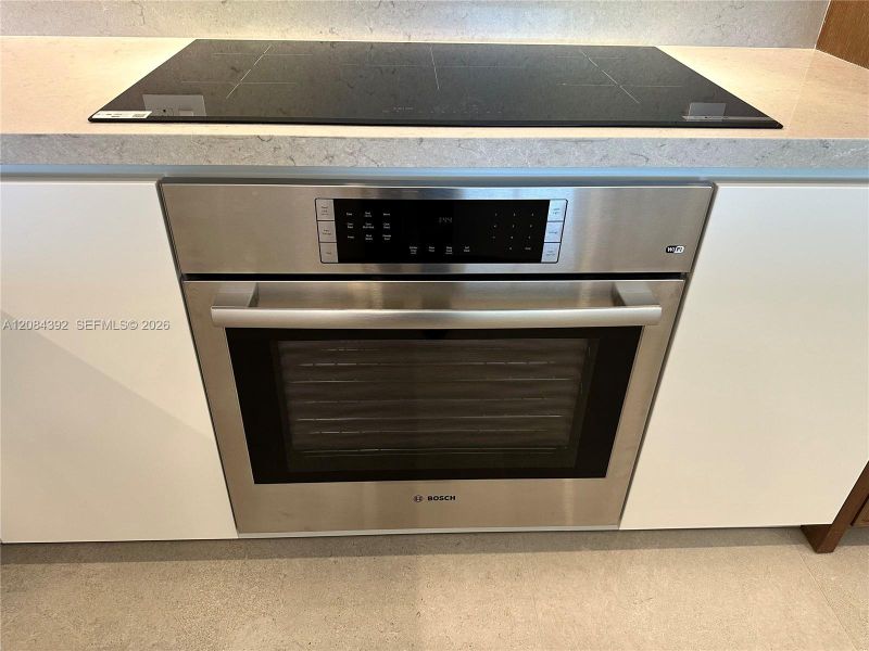 Sleek Induction Cooktop and Bosch Oven