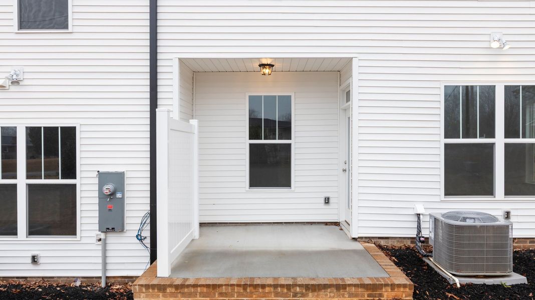 Exterior details and patio area of a home in Pearson Road Townhomes, Easley (Image 20).