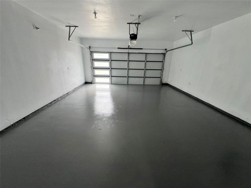 Garage featuring a garage door opener Garage featuring a garage door opener