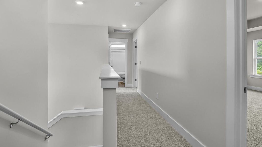 Spacious, unfurnished interior of a new home in The Haven at Indigo Preserve, Leland (Image 24).