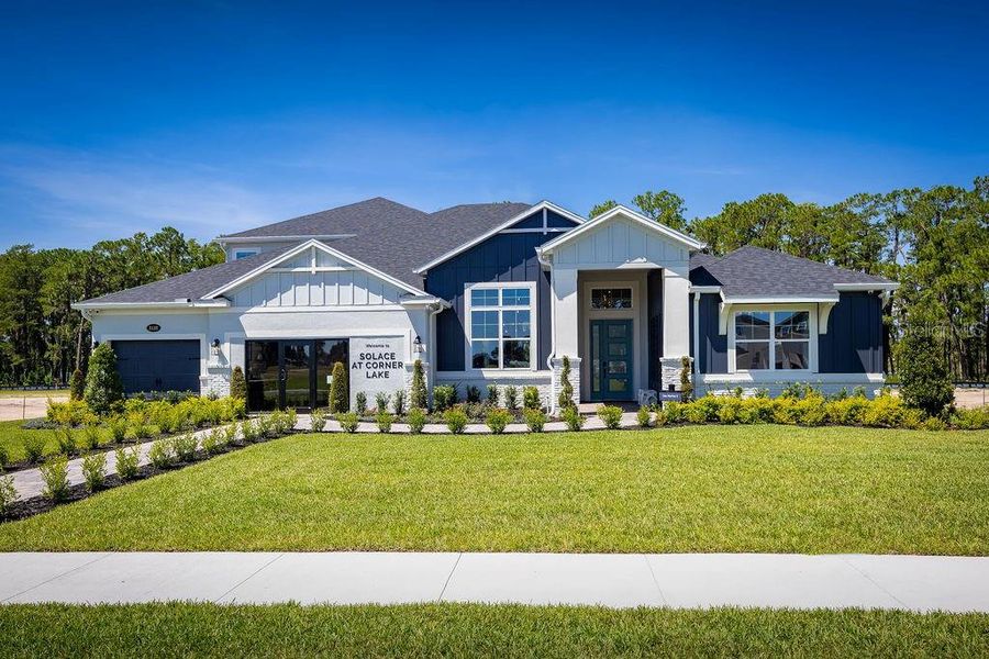 Front exterior of a new home in Solace at Corner Lake, Orlando, FL, highlighting curb appeal (Image 23).