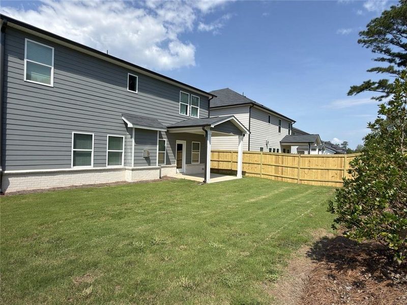 Exterior details and patio area of a home in Martin Springs - Estate Series, Lawrenceville (Image 20).