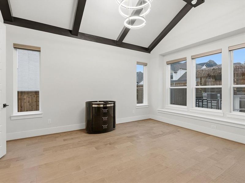 Vaulted ceiling with exposed beams and a contemporary chandelier Vaulted ceiling with exposed beams and a contemporary chandelier
