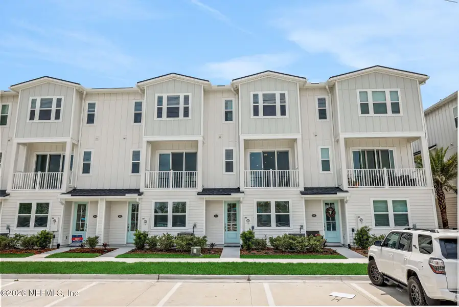 Front exterior of a new home in , Jacksonville Beach, FL, highlighting curb appeal (Image 25).