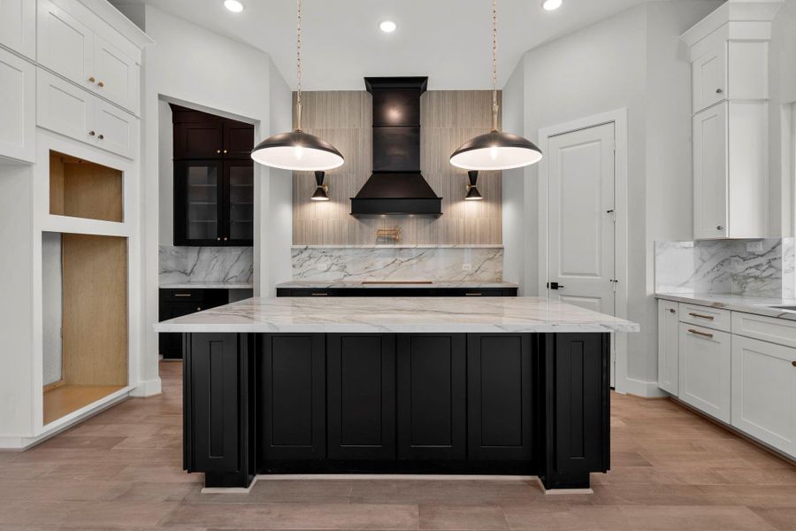 Full view kitchen area which is open to the living room.