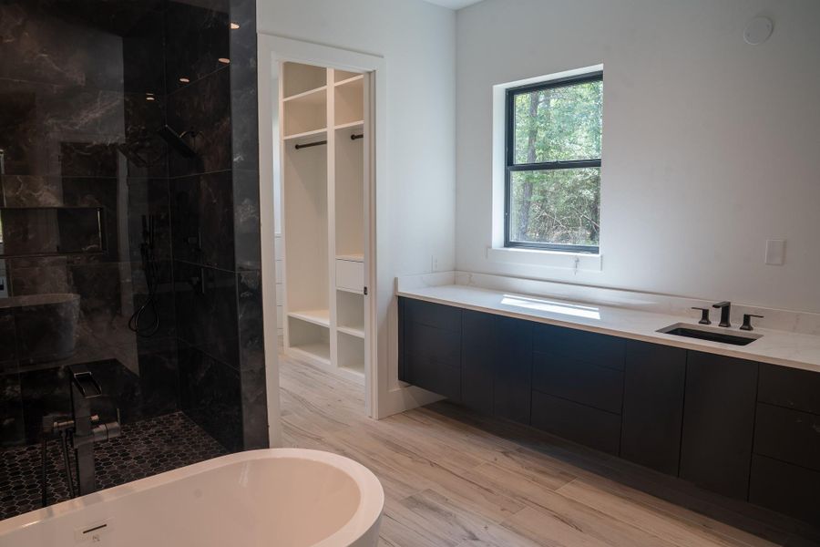 Impressive primary closet, offering an abundance of storage space that is sure to impress.