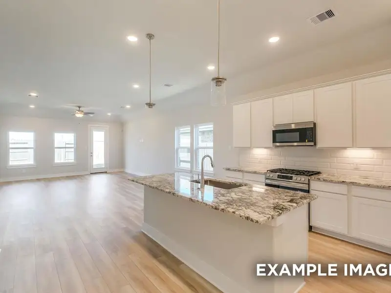 Furnished interior view inside a new home in Sunterra, Katy (Image 4).