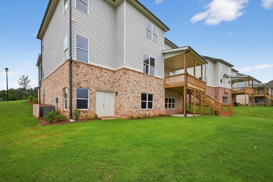 Front exterior of a new home in Traditions Of Braselton, Jefferson, GA, highlighting curb appeal (Image 24). Front exterior of a new home in Traditions Of Braselton, Jefferson, GA, highlighting curb appeal (Image 24).