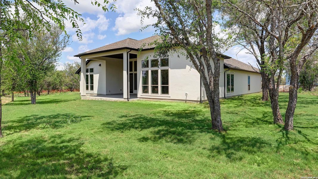 Exterior details and patio area of a home in Megan's Landing, Castroville (Image 4).