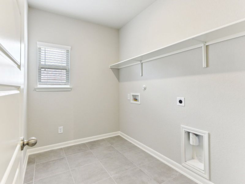 Laundry room in the Matador floorplan at a Meritage Homes community.